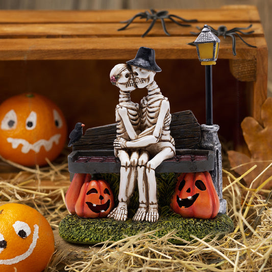 TERESA'S COLLECTIONS Love Never Dies Halloween Decorations with Solar Lights for Garden Decor,Romantic Skeleton Couple Kissing on Coffin Chair,Resin Pumpkin Decor Gifts for Party,Home,Outdoor,9.5"