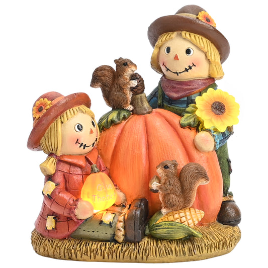 TERESA'S COLLECTIONS Fall Decor,Scarecrow Decor,Autumn Scarecrow Couple Holding Pumpkin and Sunflower with Solar Lights,Waterproof Resin Outdoor Fall Decor, Fall Gifts Outdoor/Indoor,6.3"